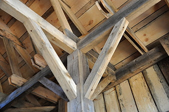 Rustic wooden roof beams and timber frame construction
