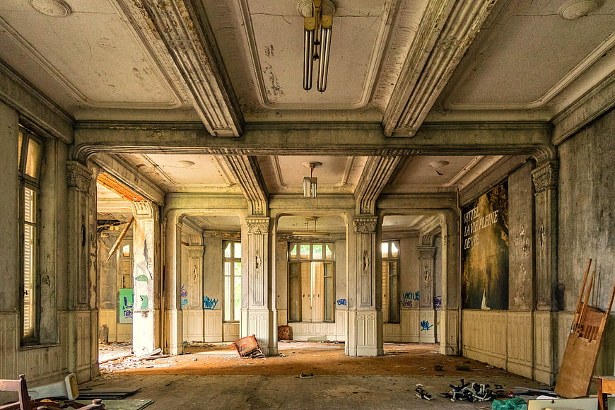 Abandoned Grand Hotel Lobby Interior with Peeling Paint and Decay