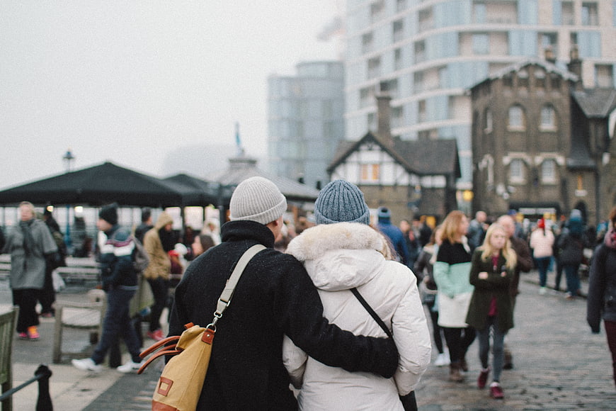 Couple Walking in Winter City Street
