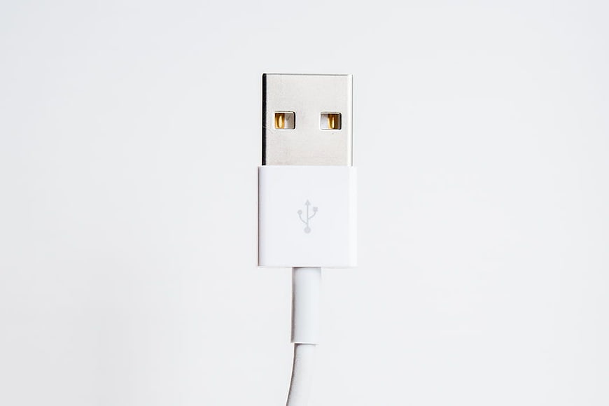 Close-up of White USB Connector on White Background