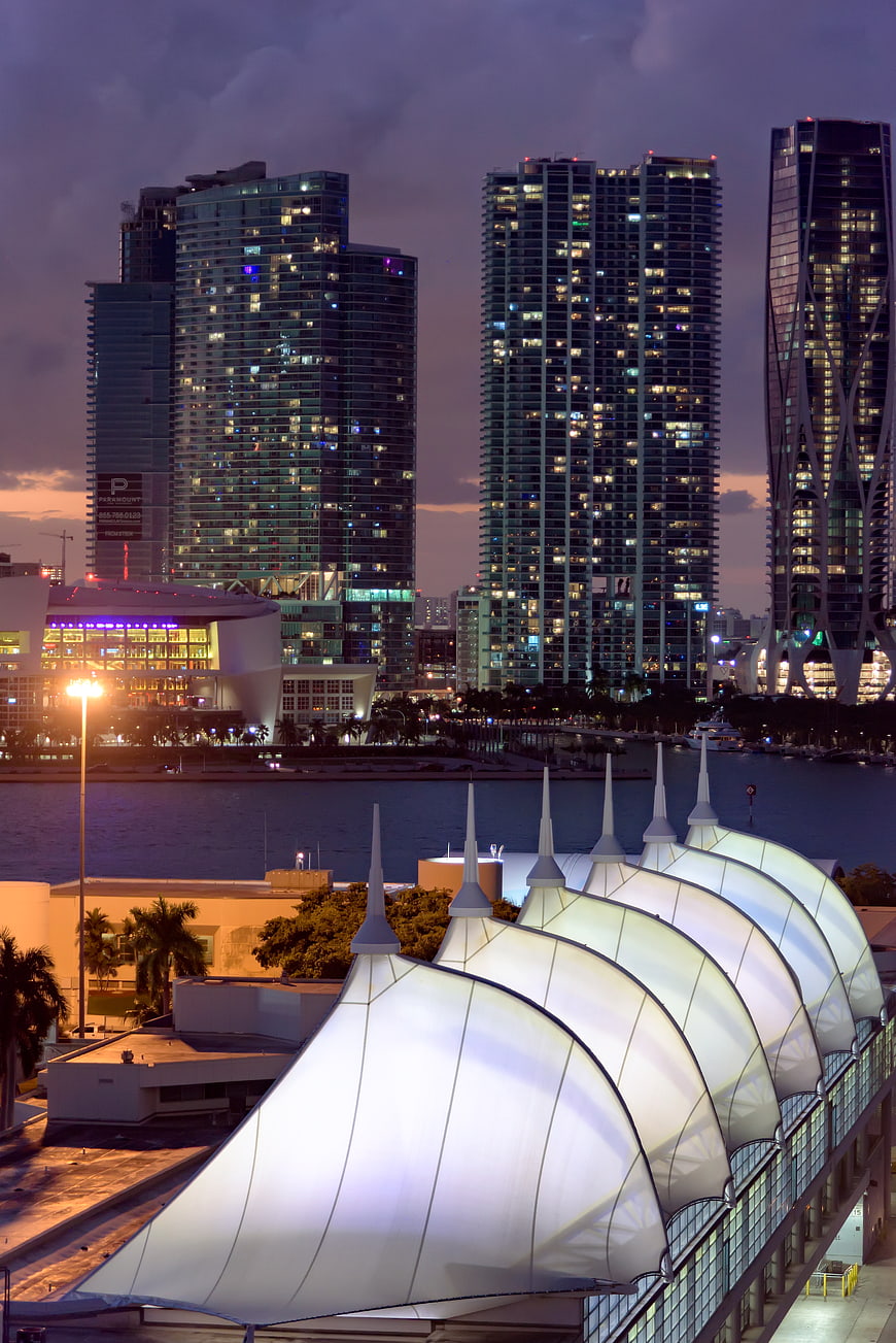 Miami skyline at dusk with illuminated white canopy structure