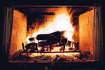 Cozy Fire Burning in Brick Fireplace with Logs