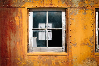 Rusty Yellow Metal Wall with Weathered Window Frame