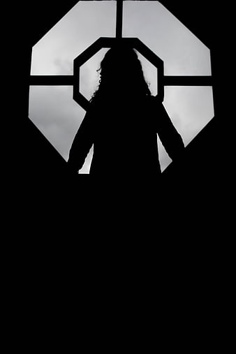 Silhouette of woman in octagonal window frame