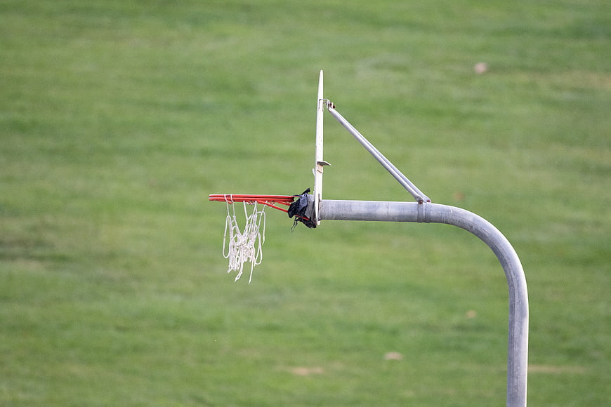 Outdoor Basketball Hoop on Green Grass Field