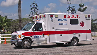 Spanish Lookout Rescue Team Ambulance Parked In Tropical Park