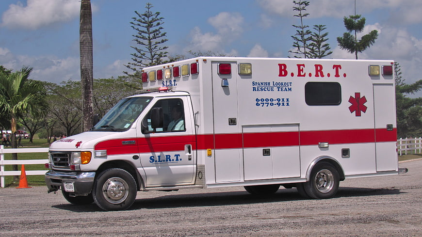 Spanish Lookout Rescue Team Ambulance Parked In Tropical Park