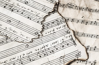 Vintage Burnt Sheet Music with Torn Edges