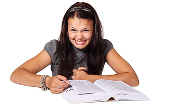 Young Woman Making Disgusted Face While Studying