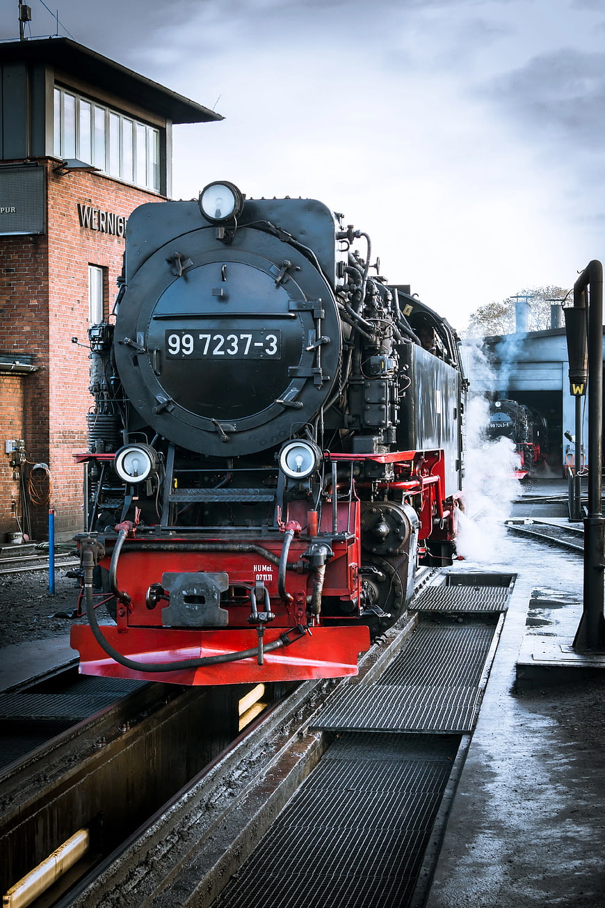 Vintage Black Steam Locomotive at Railway Station