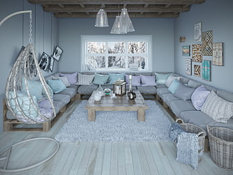 Cozy blue living room with hanging chair and winter view