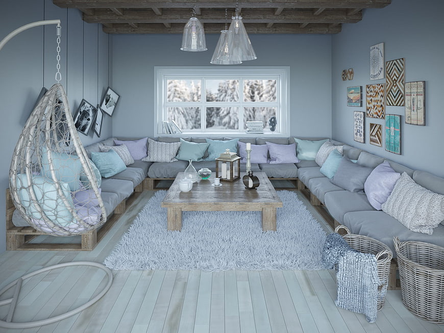 Cozy blue living room with hanging chair and winter view