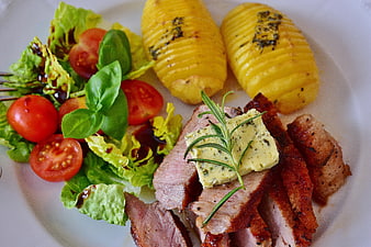 Grilled Veal Steak With Hasselback Potatoes And Fresh Garden Salad