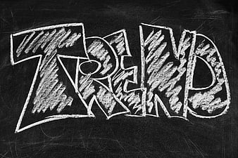 Trend written in chalk graffiti style on blackboard
