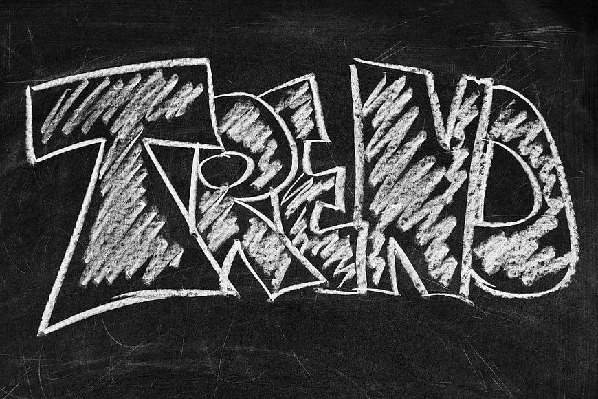 Trend written in chalk graffiti style on blackboard