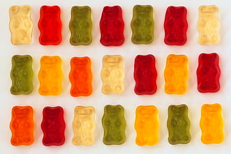 Colorful Gummy Bears Arranged in Grid on White Background
