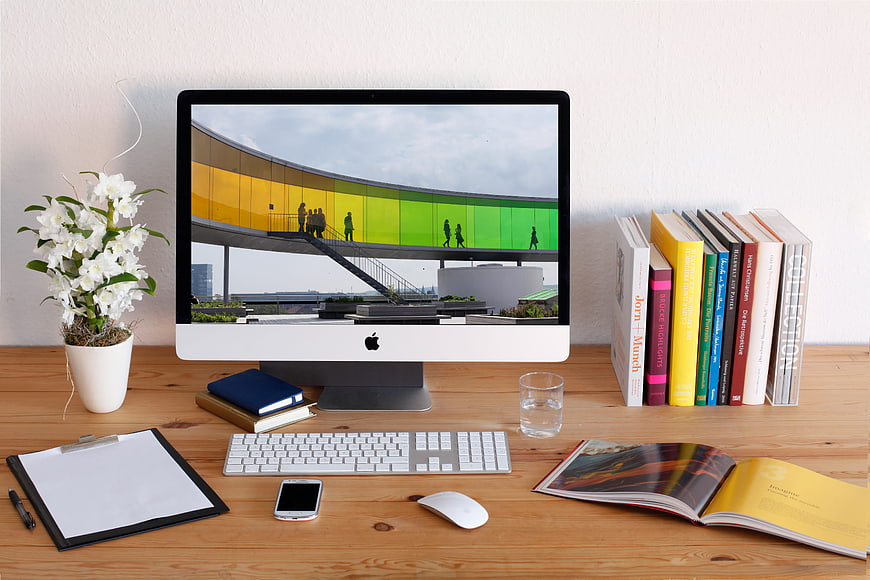 Modern creative workspace with iMac and colorful architecture
