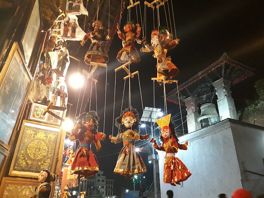 Traditional String Puppets Hanging at Night in Nepal