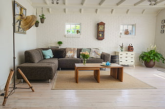 Bright Rustic Living Room with Brown Sofa and Wooden Table