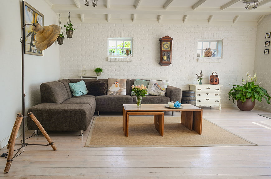 Bright Rustic Living Room with Brown Sofa and Wooden Table