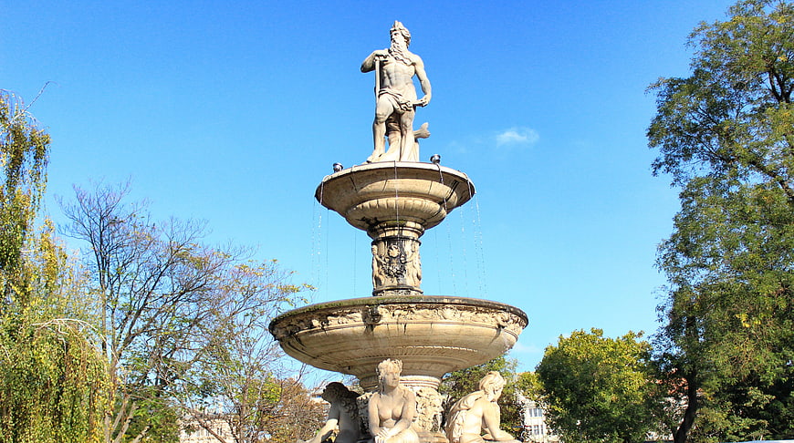Classical Stone Fountain with Neptune Statue in Park