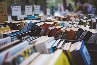 Rows of used books at an outdoor market stall