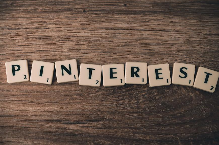 Pinterest spelled with Scrabble tiles on wood