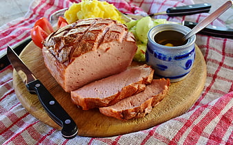 Sliced Bavarian Liverwurst with Potato Salad and Mustard on Wooden Board