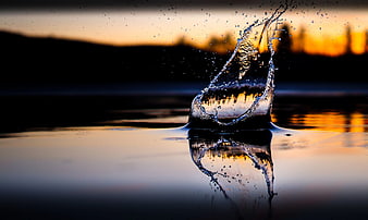 Dramatic Water Splash Crown at Sunset with Reflection