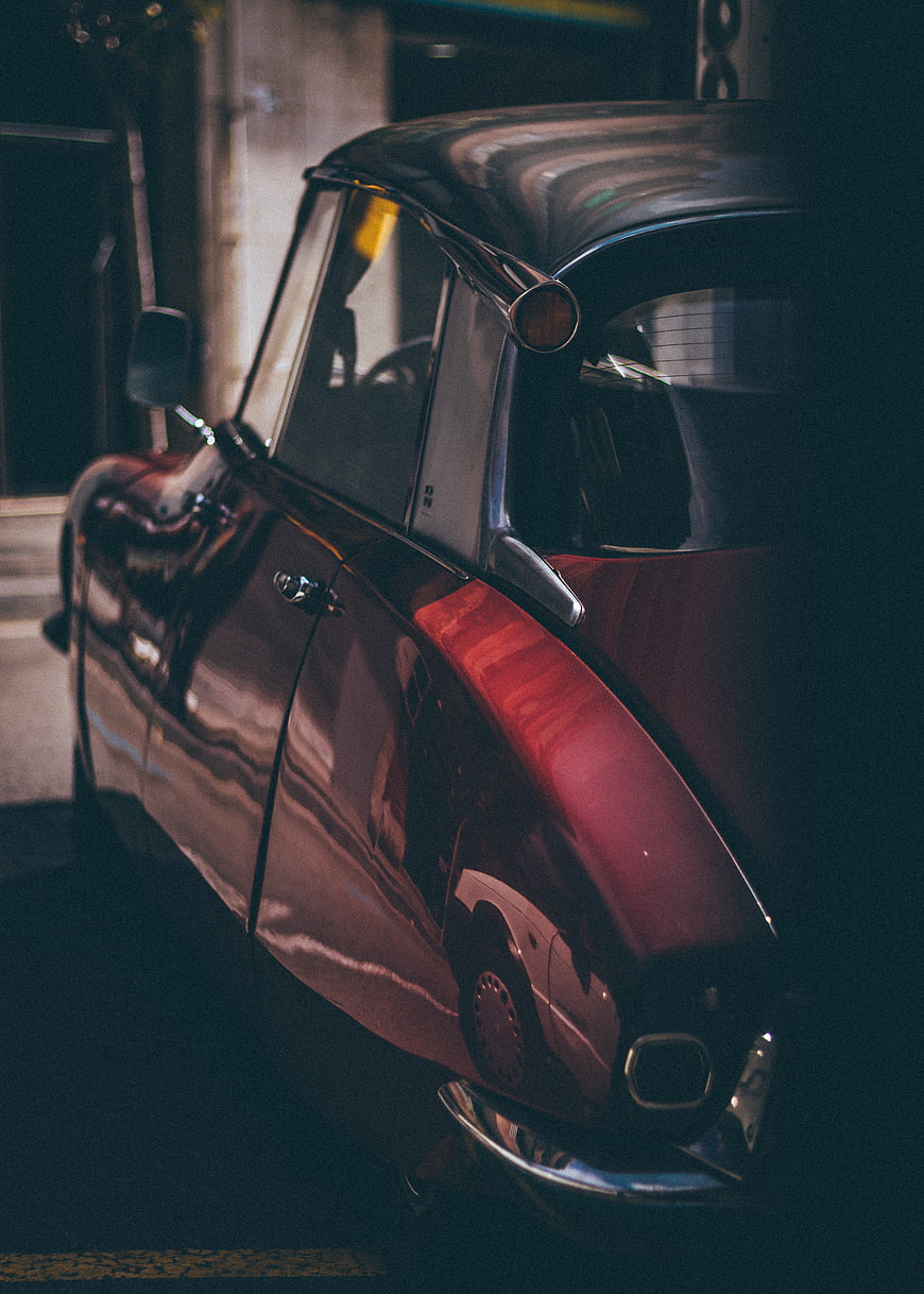 Vintage red car rear detail at night