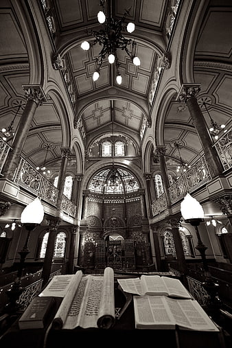 Interior of historic Brighton synagogue with Torah scrolls and ornate architecture