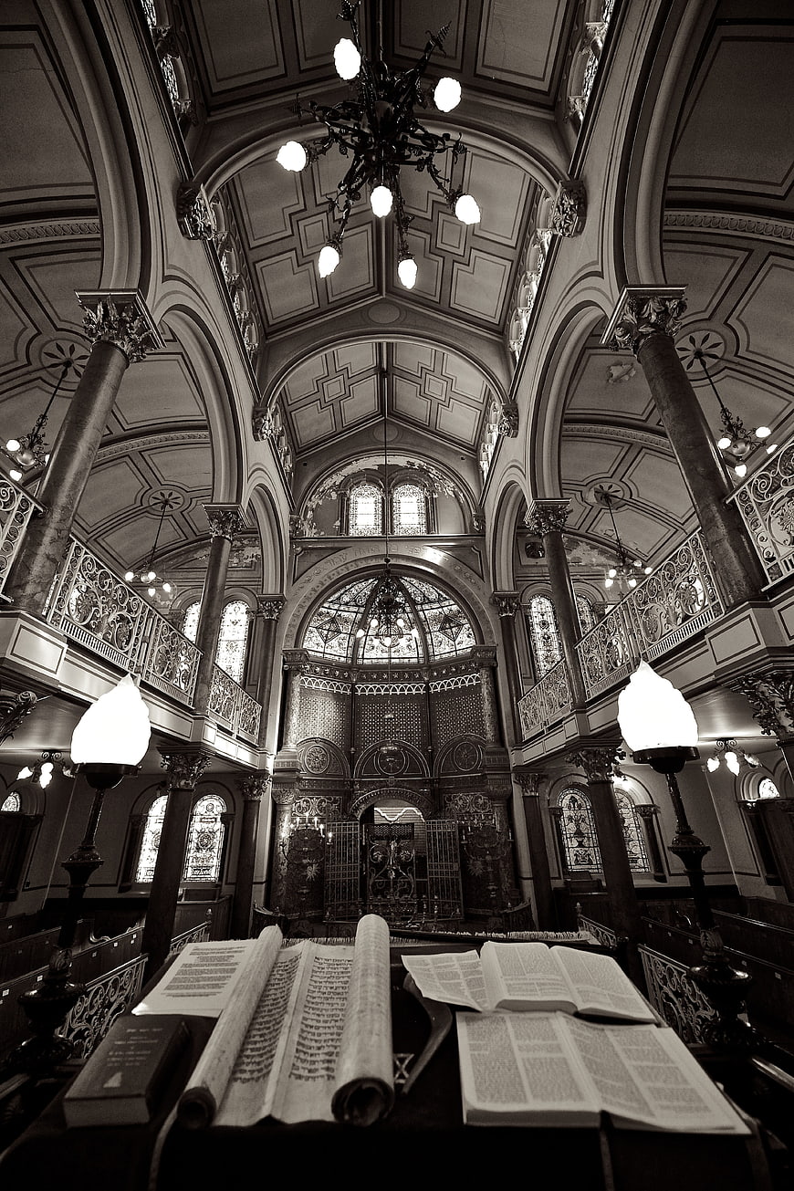 Interior of historic Brighton synagogue with Torah scrolls and ornate architecture