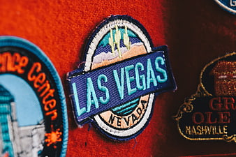 Close-up of Las Vegas Nevada embroidered travel patch on red fabric