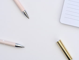 Minimalist Pink Pens and Gold Cap on White Desk