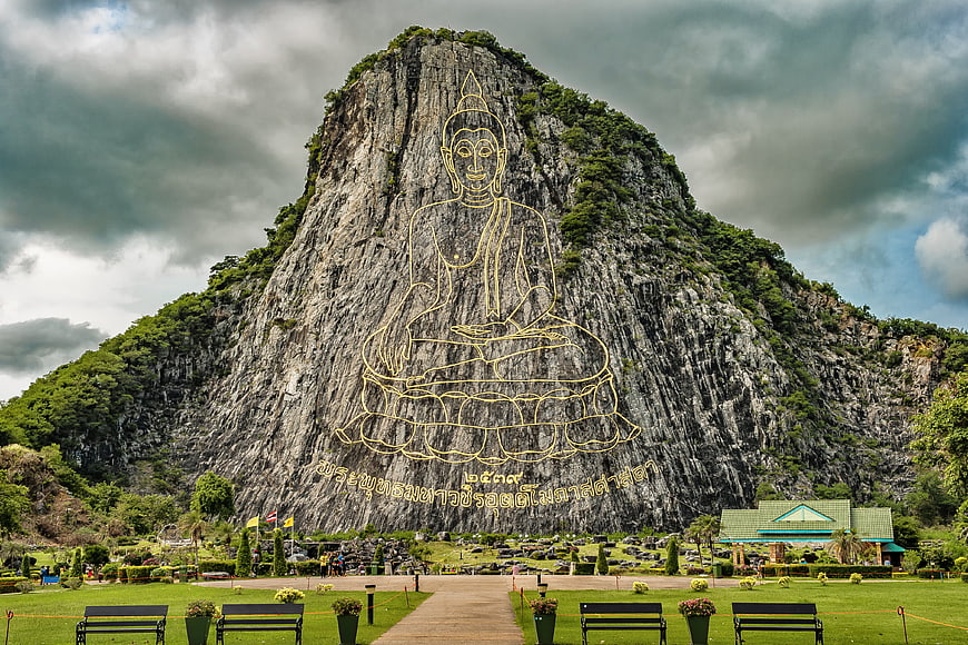 Giant Golden Buddha Outline on Cliff Face in Thailand