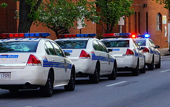 Line of Baltimore Police Cars with Flashing Lights