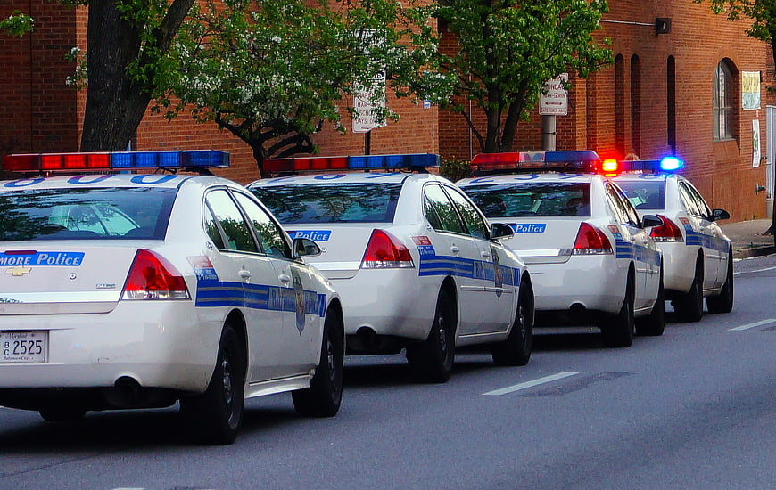 Line of Baltimore Police Cars with Flashing Lights