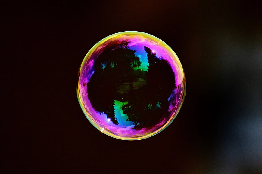 Colorful Soap Bubble with Iridescent Reflections on Dark Background
