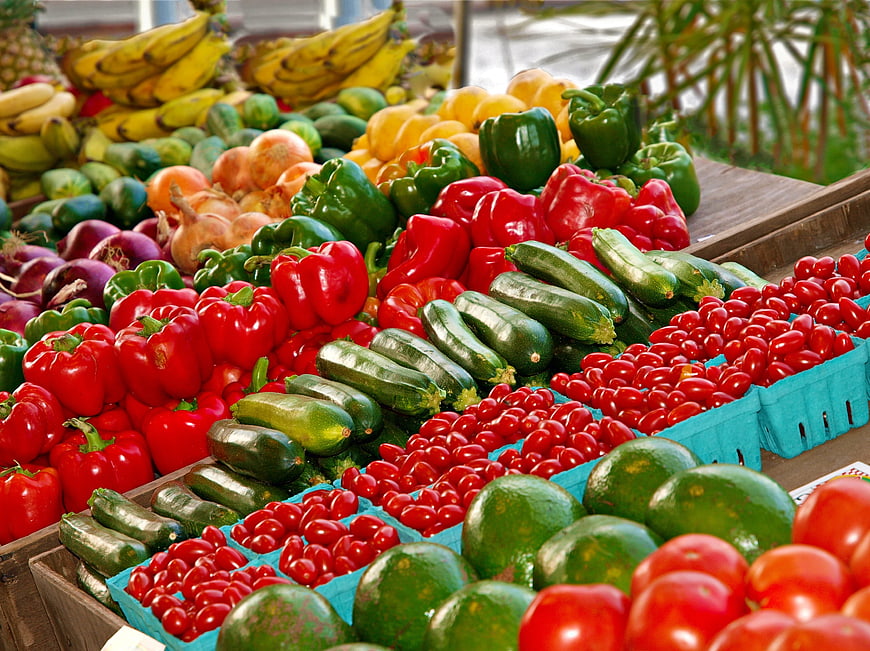 Fresh colorful vegetables and fruits at outdoor market stall