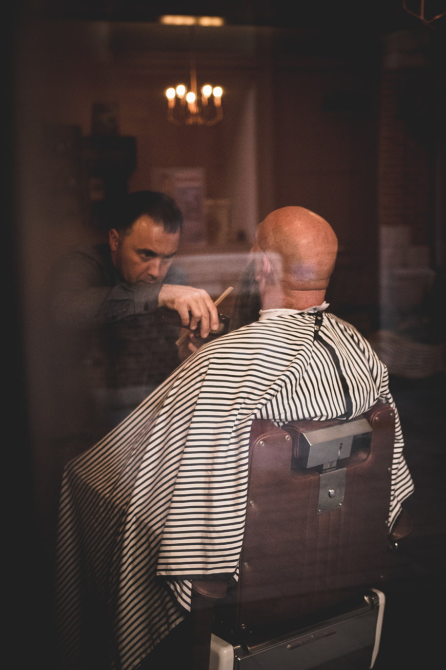 Barber Shaving Customer in Vintage Barbershop