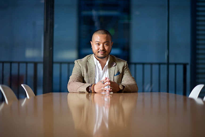 Professional Asian businessman sitting at conference table