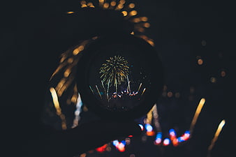 Fireworks Reflected in Snow Globe at Night