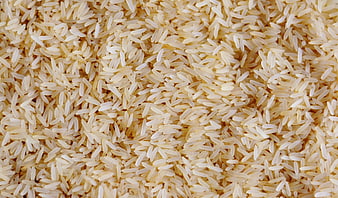 Close-up texture of raw white rice grains filling the frame