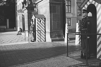 Black and white photo of soldiers standing guard in Prague