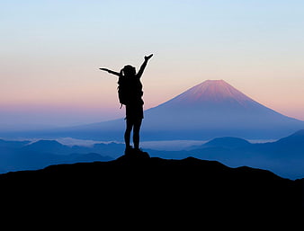 Silhouette of Hiker Celebrating with Mount Fuji Background