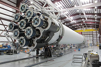 SpaceX Falcon 9 rocket engine assembly in aerospace factory