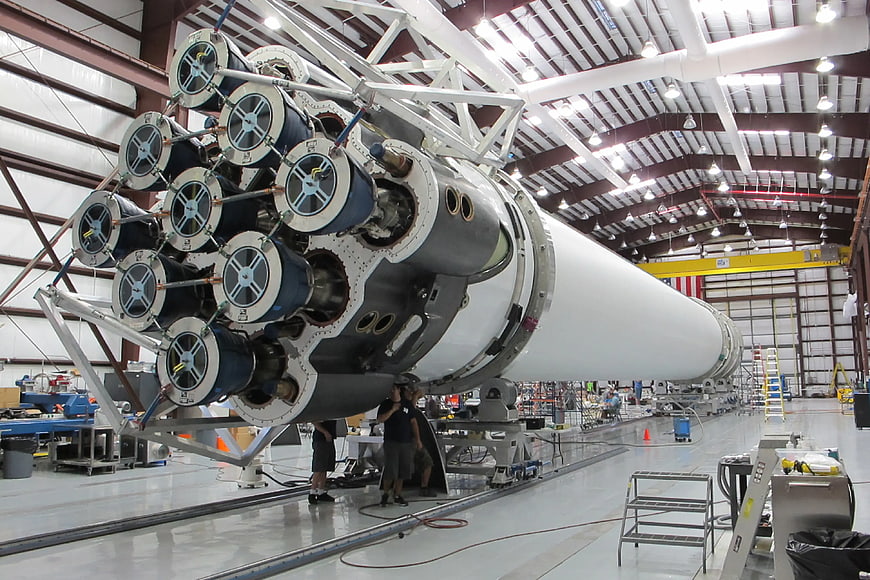 SpaceX Falcon 9 rocket engine assembly in aerospace factory
