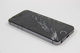 Broken Smartphone with Shattered Screen on White Background