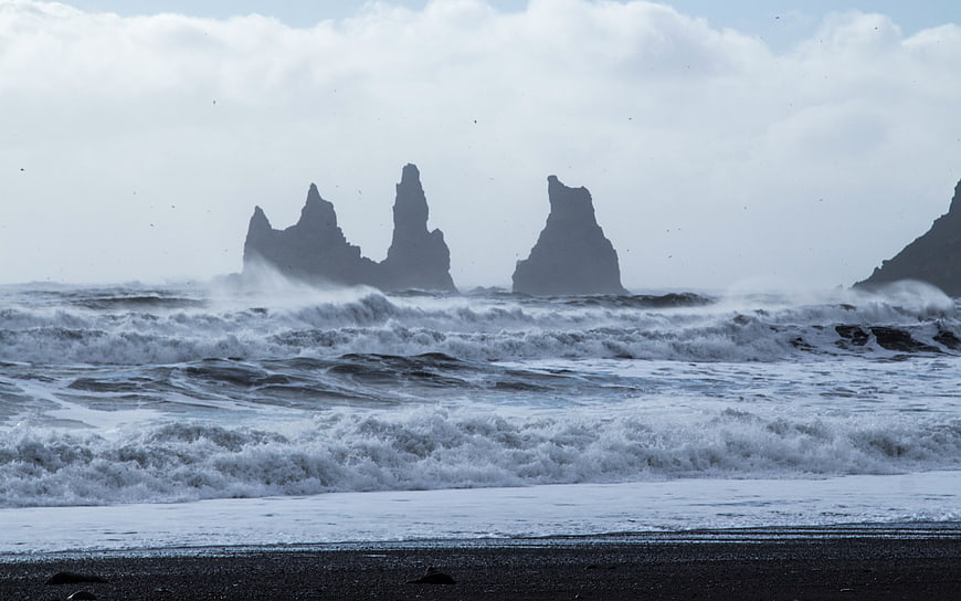 Dramatic Sea Stacks on Black Sand Beach with Rough Waves