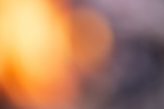 Abstract Blurred Background with Warm Orange and Cool Purple Bokeh